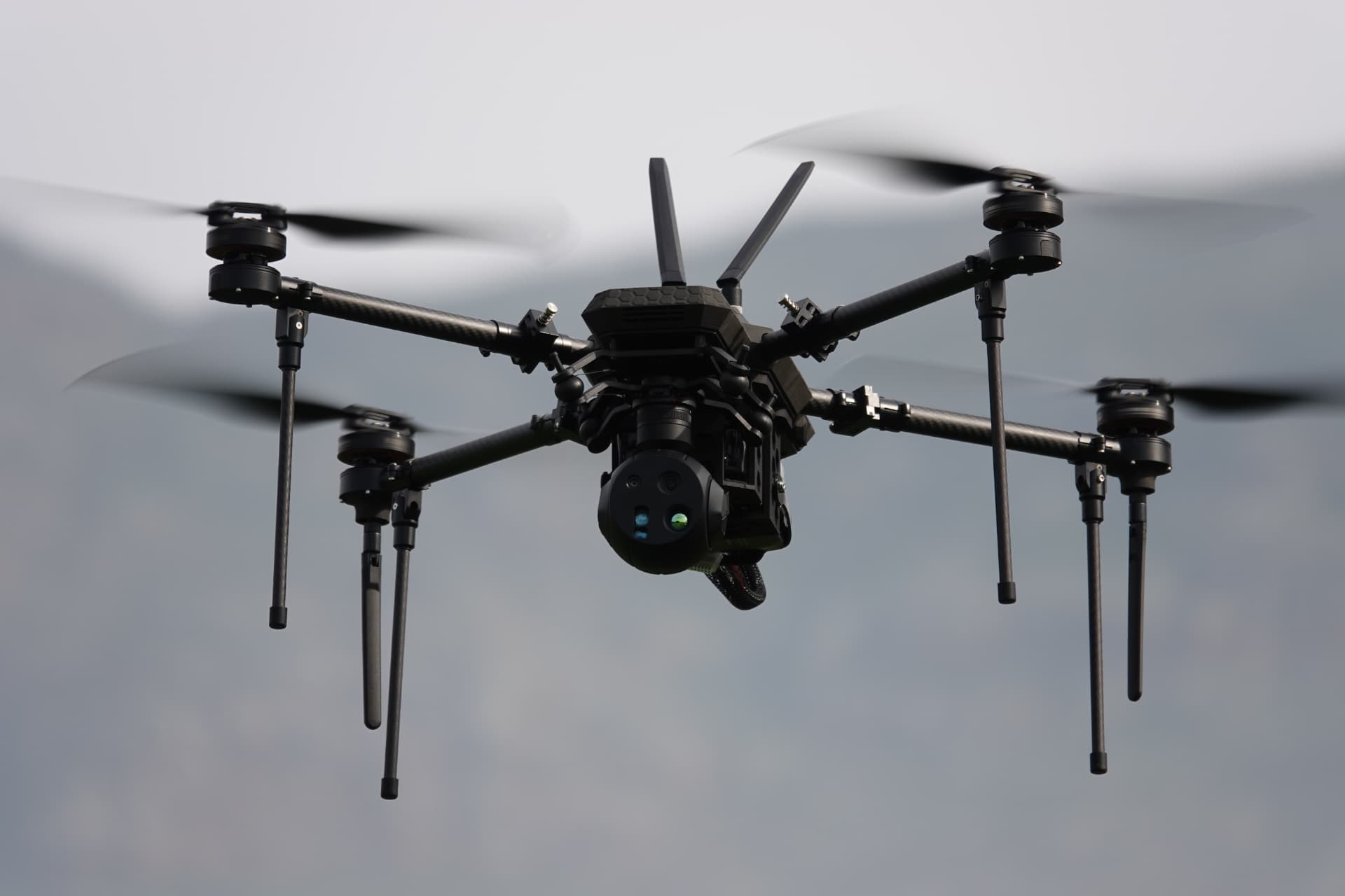RECCE long-endurance ISR quadcopter airborne with stabilised EO/IR gimbal payload