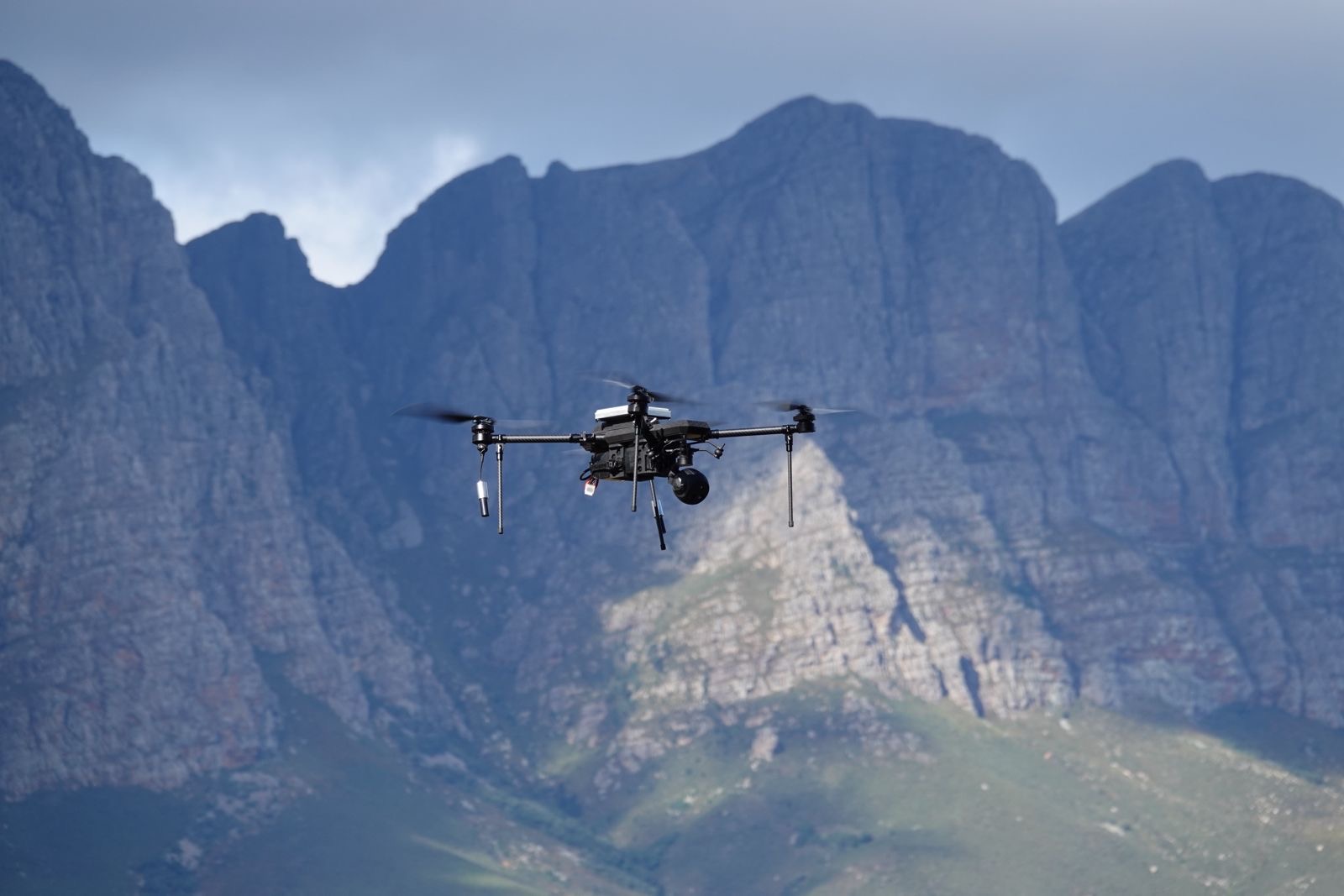 TCAT RECCE ISR drone in flight against a mountain range in South Africa